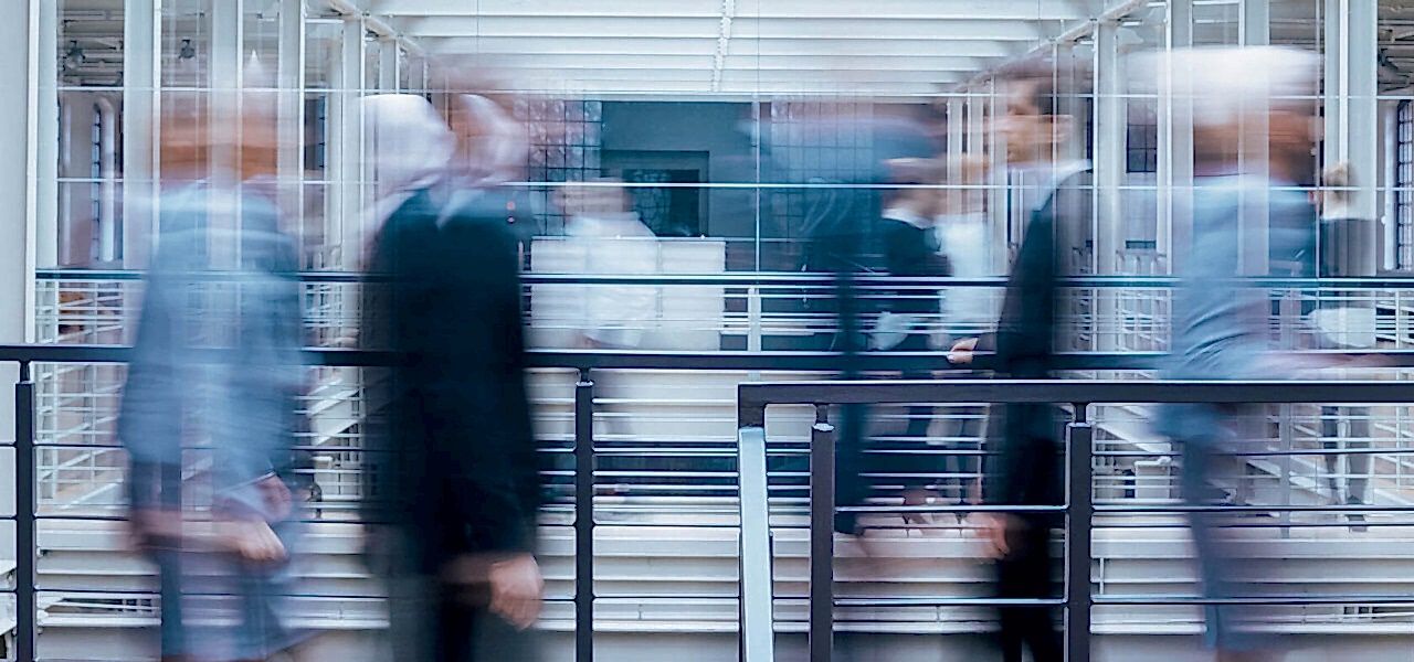 business-people-talking-in-corridor-PSVCLEM(1)