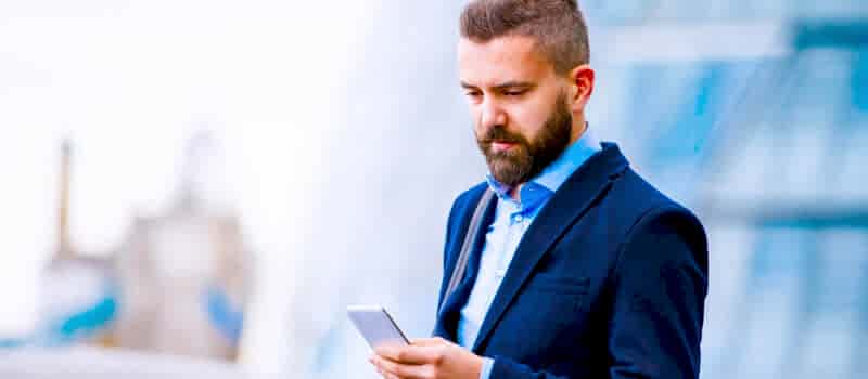 hipster-manager-with-smart-phone-london-city-hall-PBBAF8T